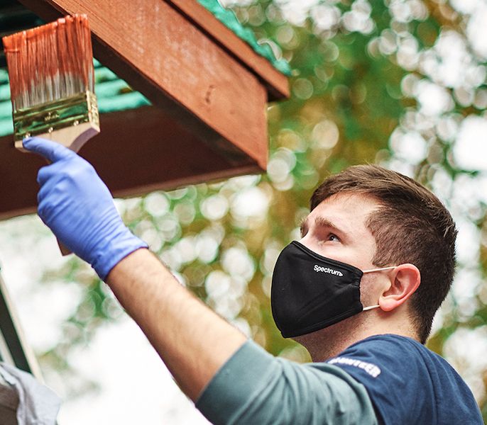 Man painting house