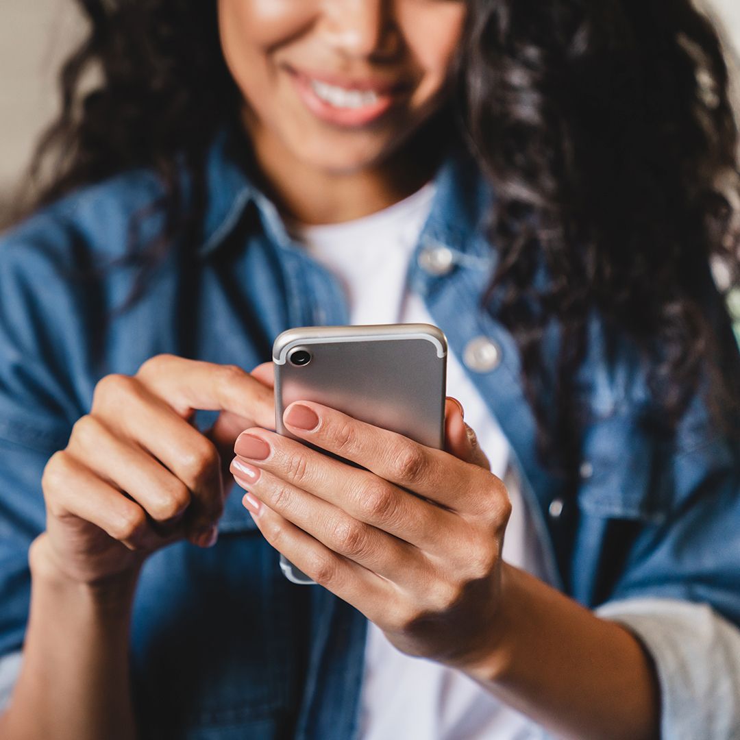 Woman holding cell phone